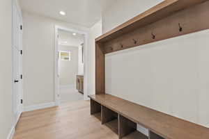 Mudroom featuring light wood-style floors and recessed lighting
