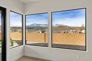 Unfurnished sunroom featuring a mountain view