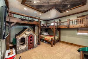 Bedroom with ornamental molding, carpet, and recessed lighting