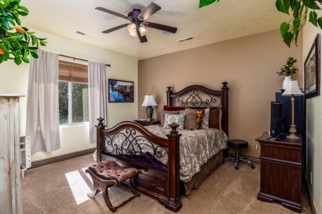 Bedroom with carpet floors and ceiling fan