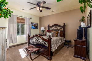 Bedroom with carpet floors and ceiling fan