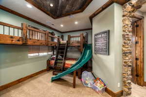 View of jungle gym with a patio area