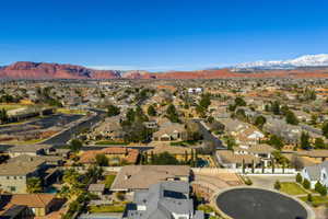 Aerial view of residential area featuring a mountainous background