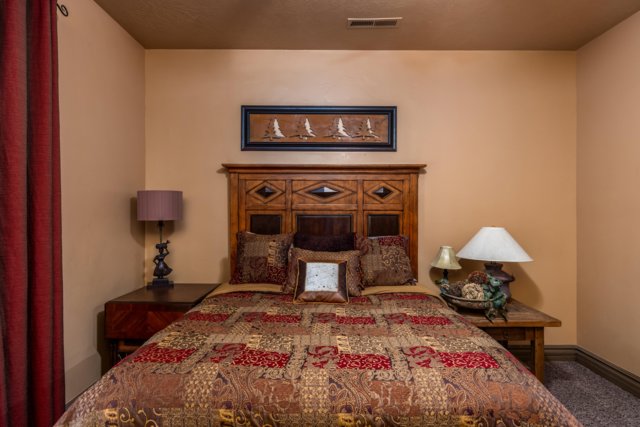 Carpeted bedroom featuring baseboards