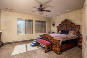 Bedroom featuring carpet floors and ceiling fan