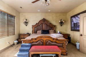 Bedroom with carpet flooring and a ceiling fan
