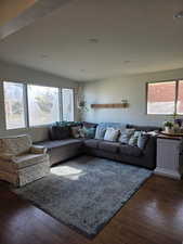 Living area with wood finished floors and recessed lighting