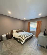 Bedroom with carpet floors and recessed lighting