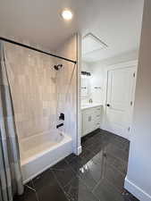 Bathroom featuring shower / tub combo and vanity