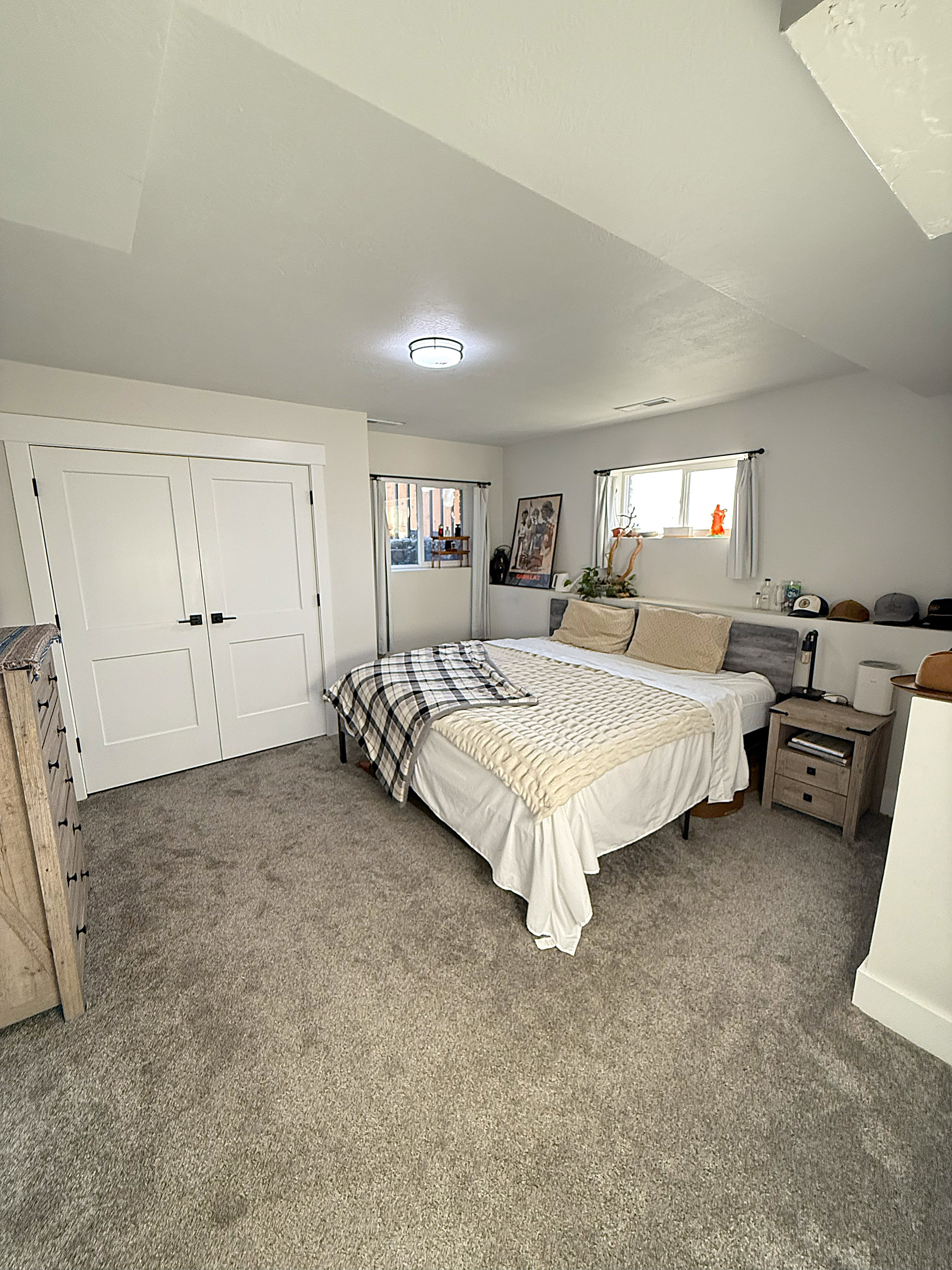 Bedroom featuring dark carpet and a closet