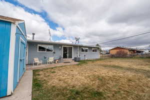 Rear view of house featuring a patio
