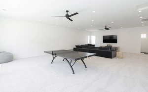 Playroom featuring light carpet, recessed lighting, and a ceiling fan