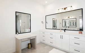 Full bathroom with vanity and light tile patterned floors