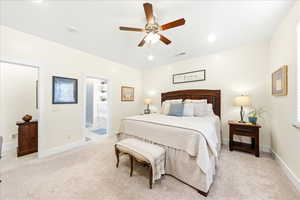 Bedroom featuring light carpet, ceiling fan, and recessed lighting