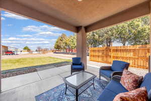 Fenced backyard with a patio area