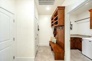 Mudroom featuring washer / clothes dryer and recessed lighting