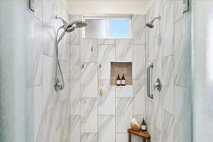 Full bathroom featuring a shower stall