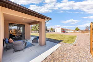 View of patio with an outbuilding