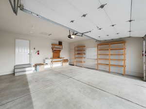 Garage with a sink and baseboards