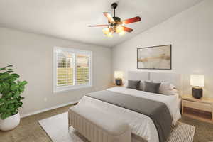 Bedroom with vaulted ceiling and a ceiling fan