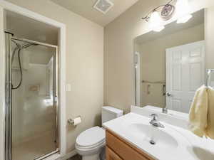 Full bathroom with vanity and a stall shower