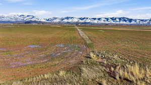 View of mountain background featuring rural landscape and large plots for crops