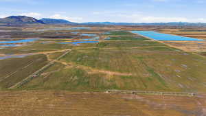 Aerial view of sparsely populated area featuring a water and mountain view