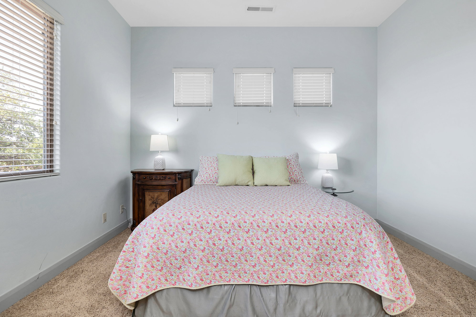 Carpeted bedroom featuring baseboards
