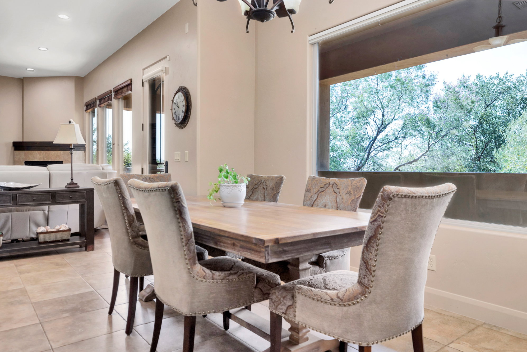 Dining area featuring light tile patterned floors and hanging lights