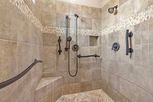 Full bathroom featuring tiled shower