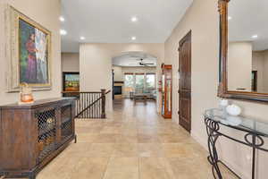 Corridor featuring recessed lighting, an upstairs landing, and light tile patterned floors