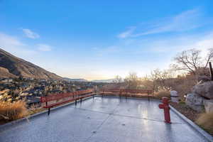 Patio terrace at dusk with a mountain view