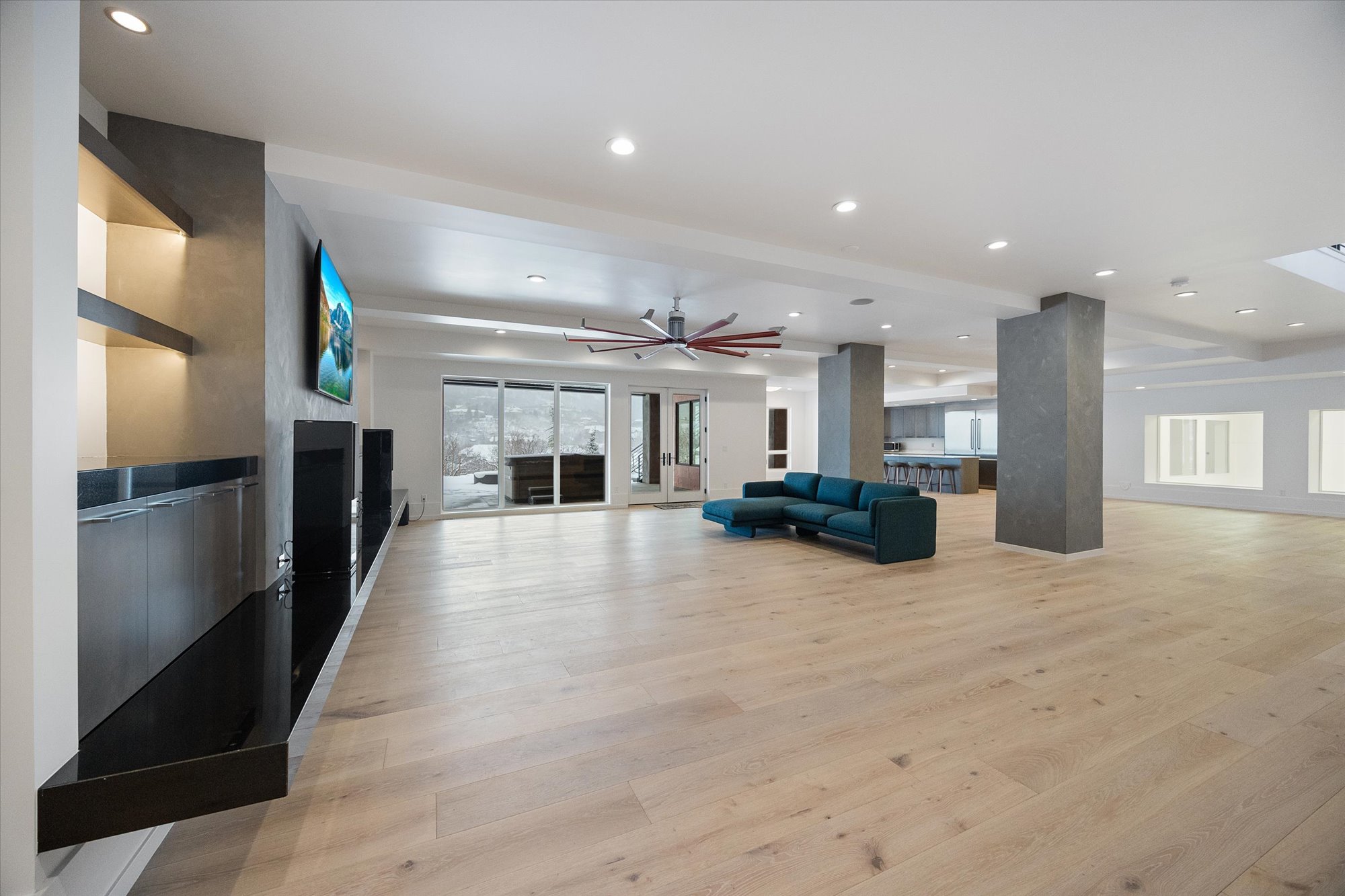 Living area featuring recessed lighting, light wood-style flooring, and ceiling fan