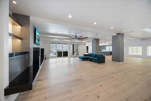 Living area featuring recessed lighting, light wood-style flooring, and ceiling fan