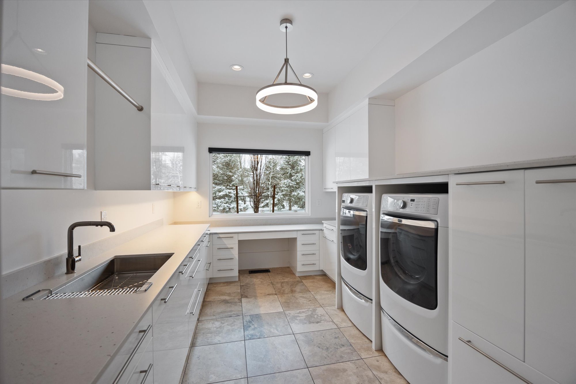 Laundry room featuring washer and clothes dryer, recessed lighting, and cabinet space