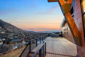 Wooden deck with a mountain view and a residential view
