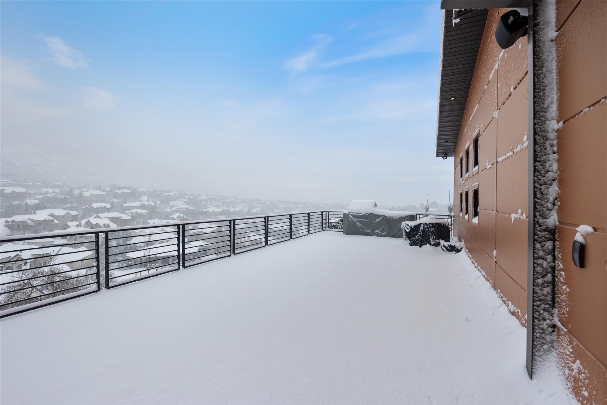 View of yard covered in snow