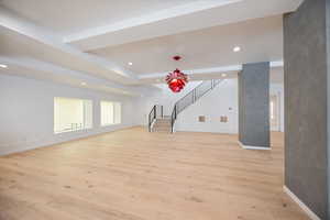 Unfurnished living room with recessed lighting and light wood finished floors