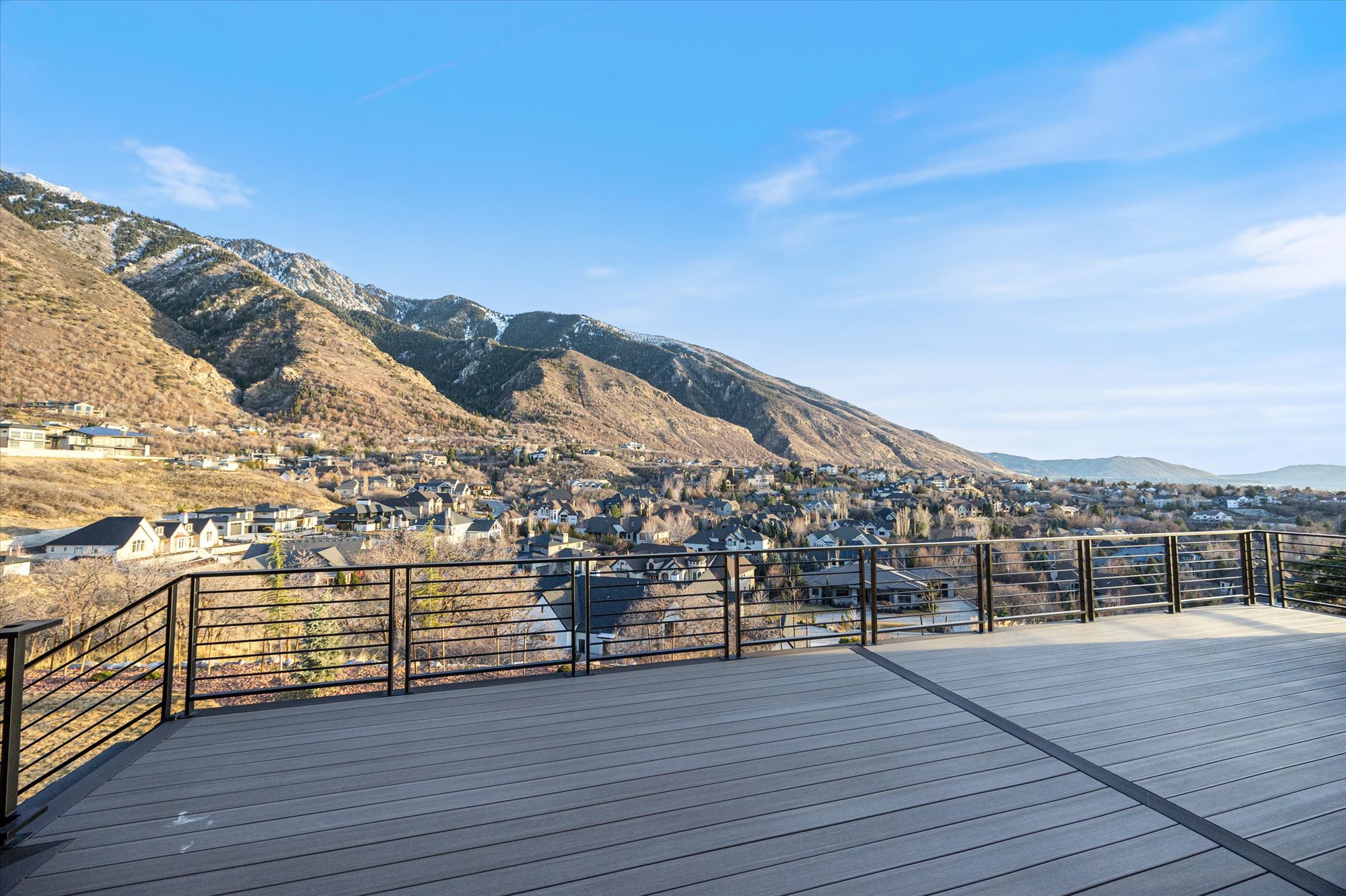 Deck with a mountain view and a residential view