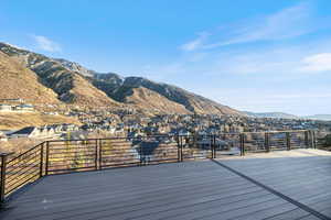 Deck with a mountain view and a residential view