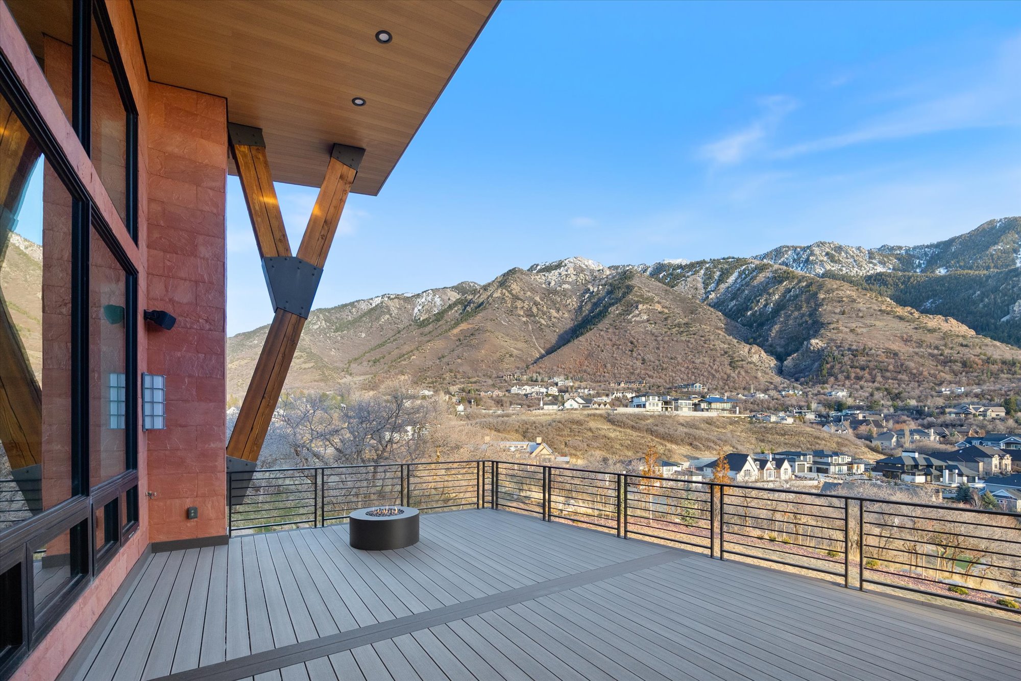 Deck with a mountain view and a residential view