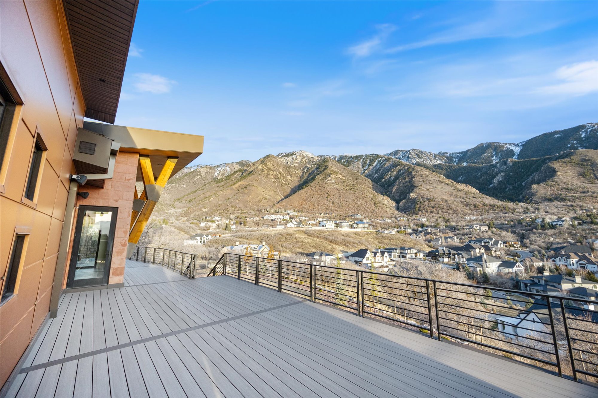 Wooden deck with a mountain view and a residential view