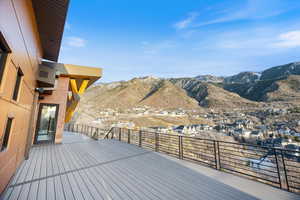 Wooden deck with a mountain view and a residential view