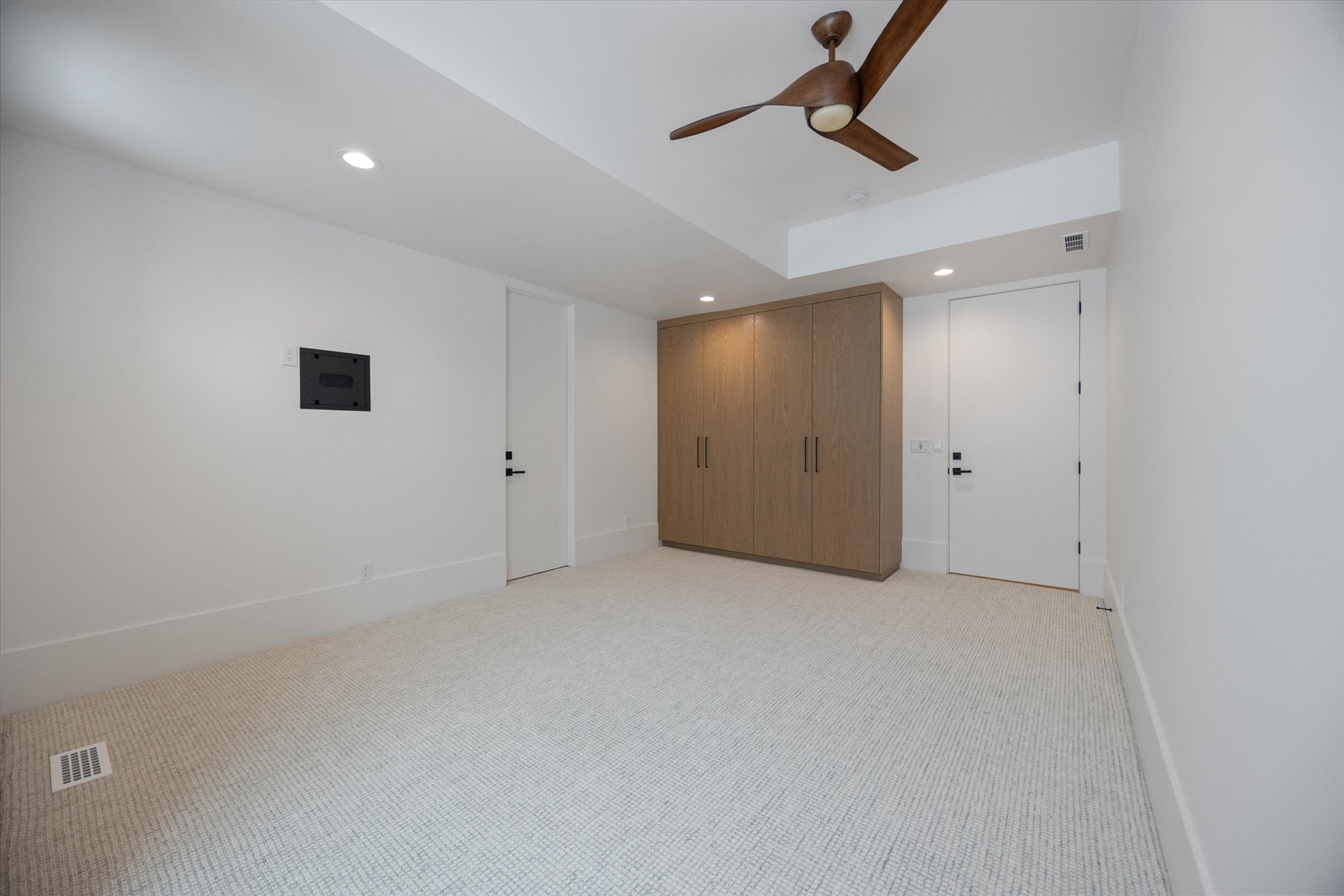 Unfurnished bedroom featuring light colored carpet, recessed lighting, and ceiling fan
