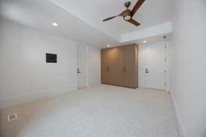 Unfurnished bedroom featuring light colored carpet, recessed lighting, and ceiling fan