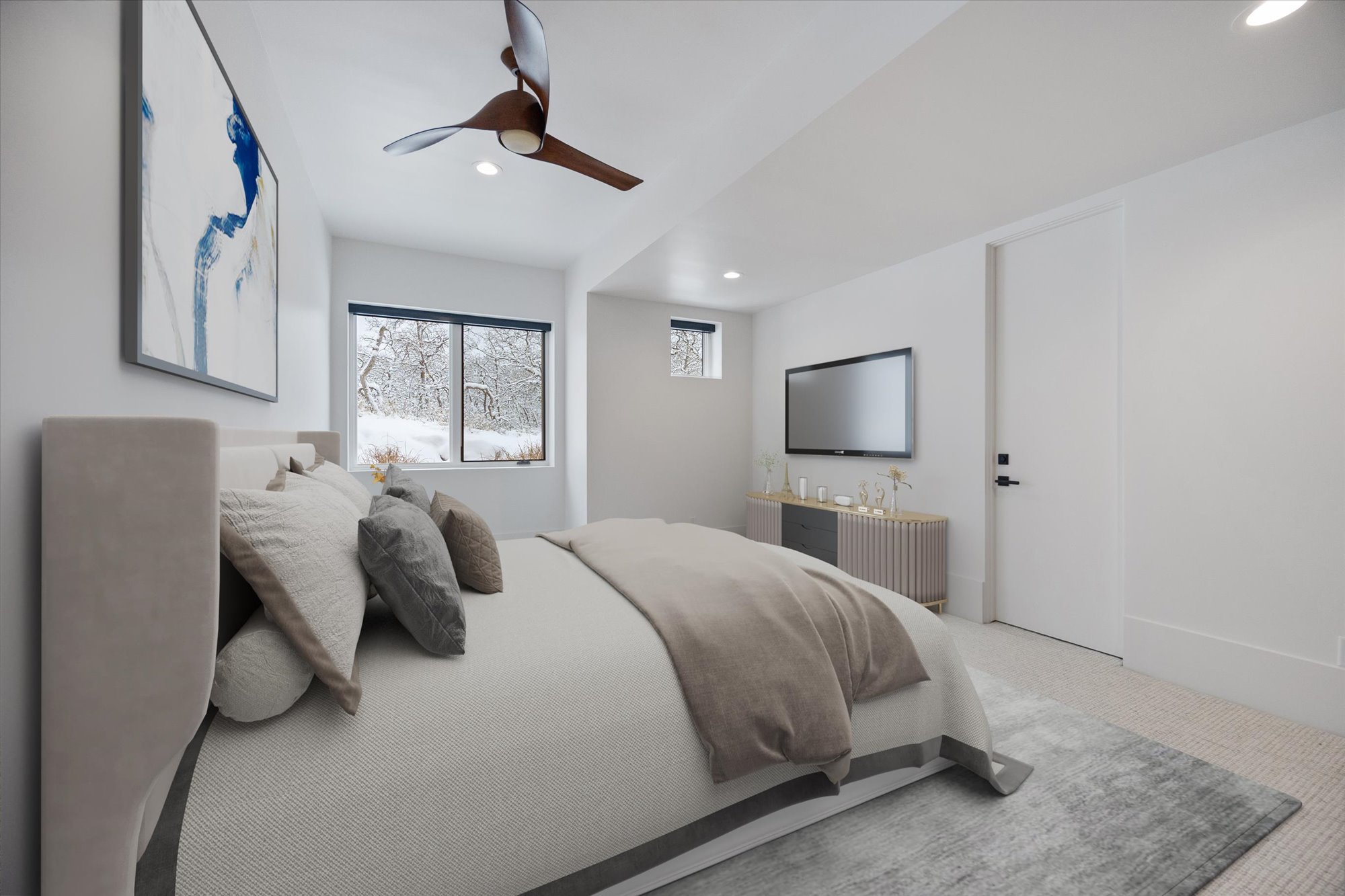 Carpeted bedroom with a ceiling fan and recessed lighting
