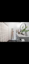 Bathroom featuring vanity and dark wood-style floors