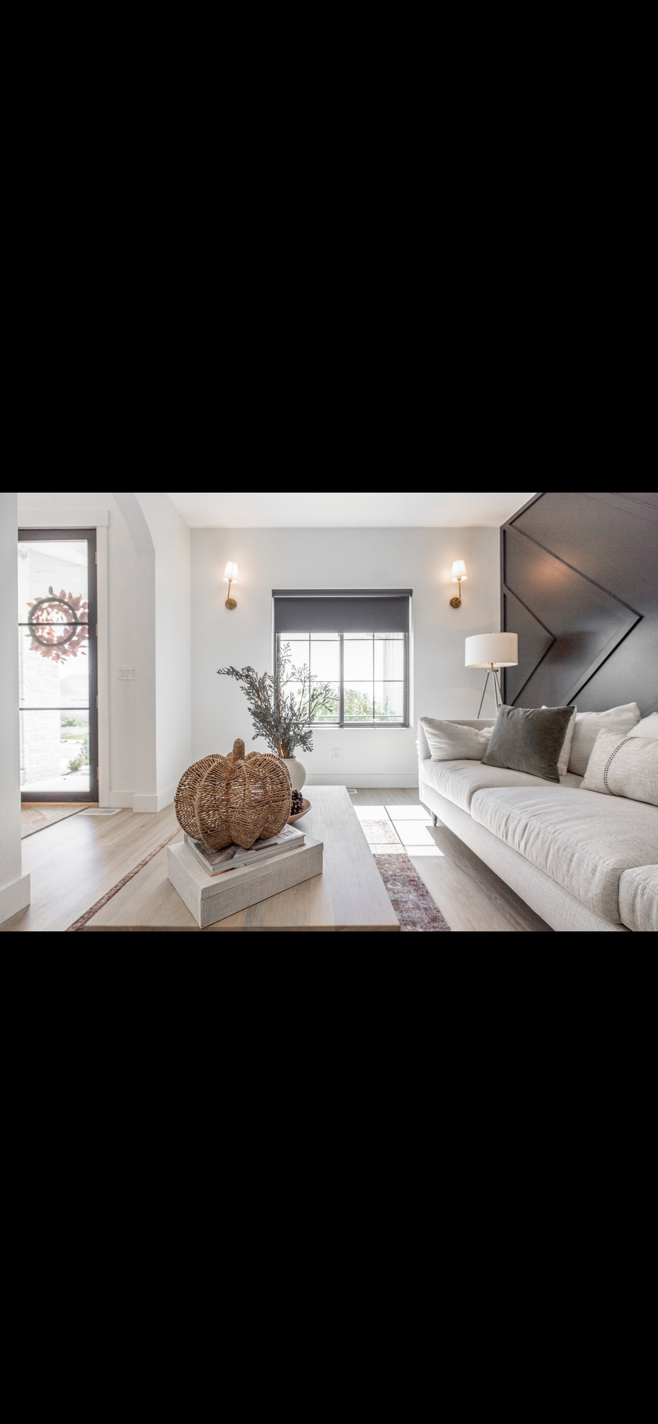 Living area with light wood-type flooring and baseboards