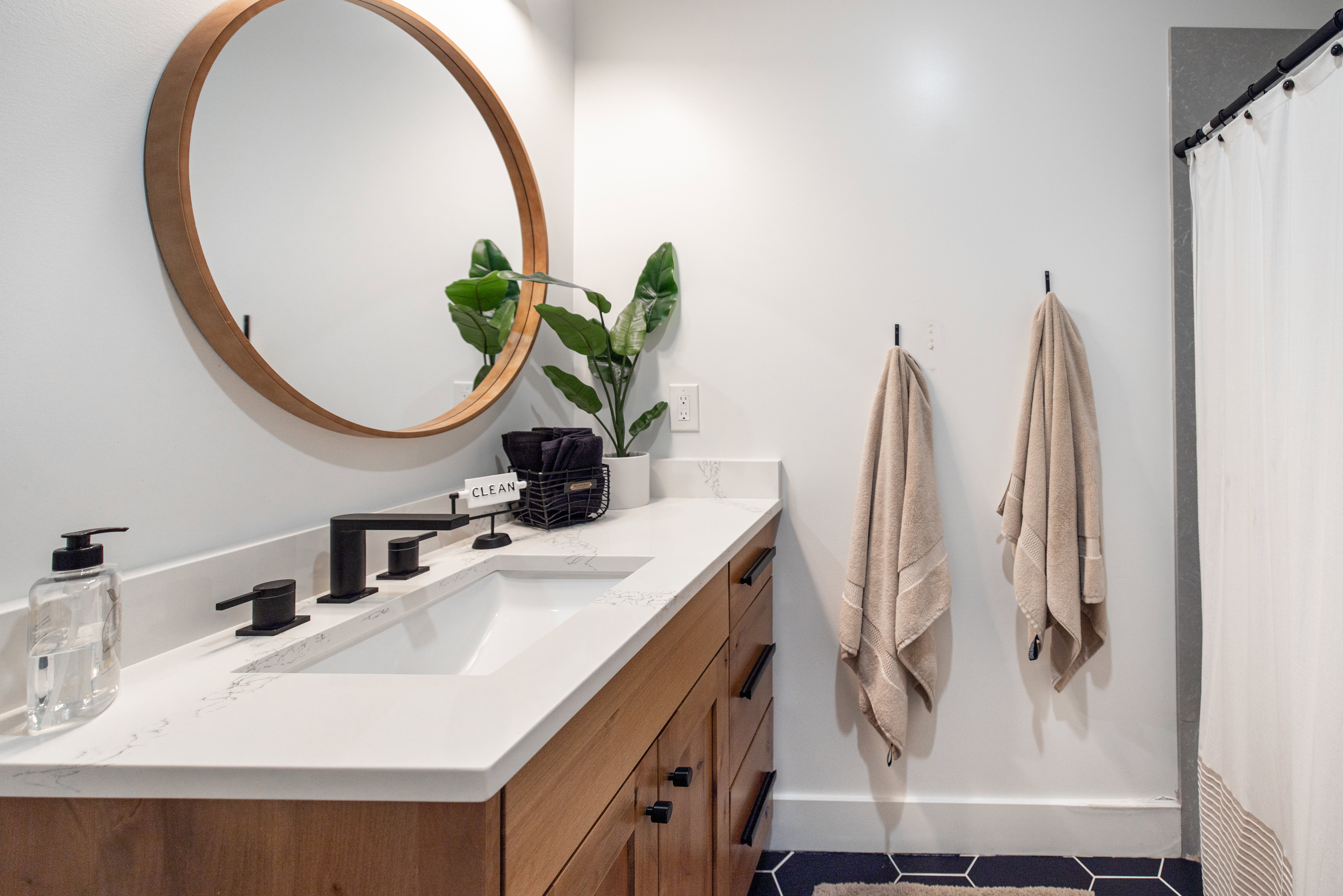 Full bathroom with vanity, a shower with curtain, and tile patterned floors