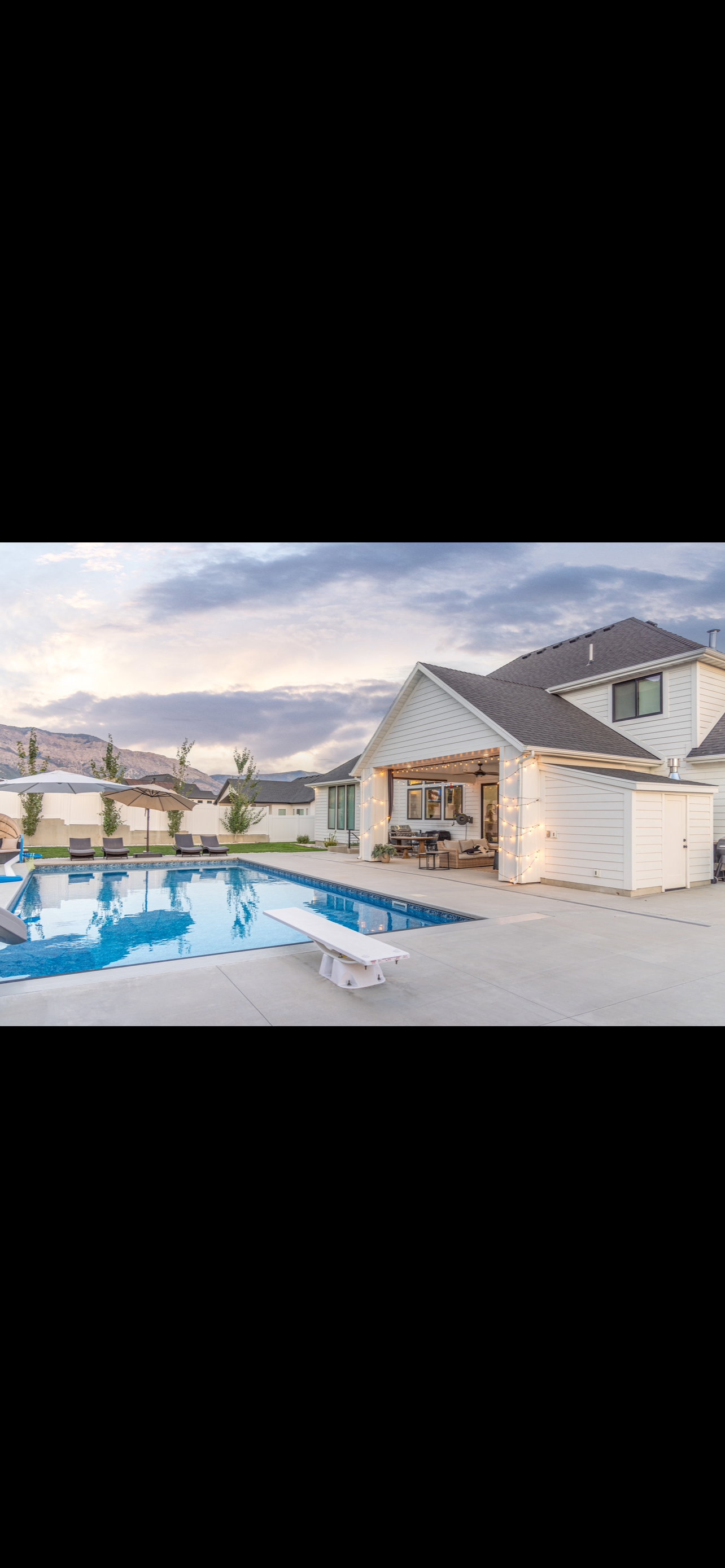 Swimming pool with a patio area